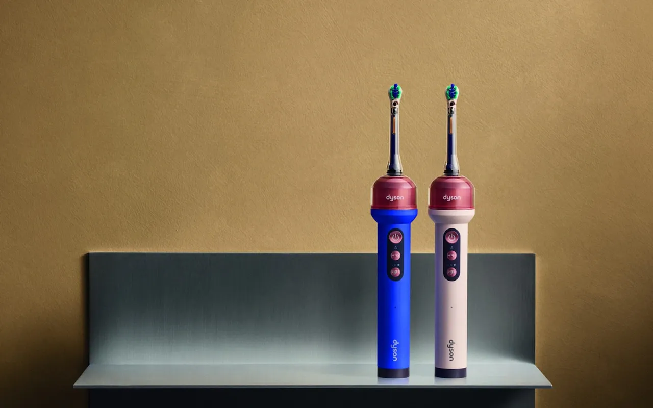 The Dyson CameraJet in its two launch colourways, blue and pink, standing on a shelf